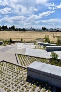 Bomanite Grasscrete Partially Concealed System is a pervious monolithic cast-in-place concrete suitable for this gabion tiered drop structure detention pond located in Denver, CO that was planted with varying grasses for greenspace and stormwater management.